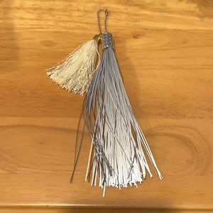 Reflective and cream tassel charm